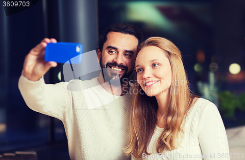 Image of happy couple with tablet pc and coffee at cafe