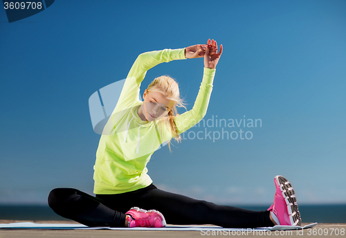 Image of woman doing sports outdoors