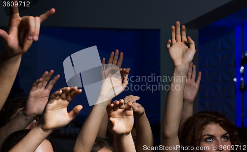 Image of close up of happy people at concert in night club