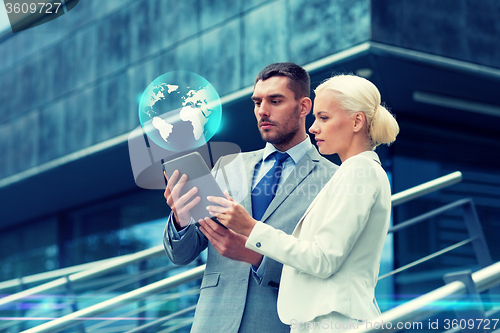 Image of businesspeople with tablet pc outdoors
