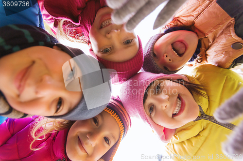 Image of group of happy children faces in circle