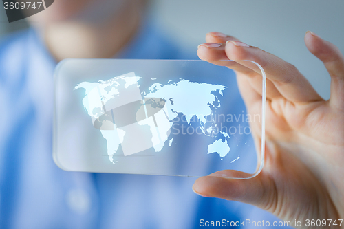 Image of close up of woman with transparent smartphone