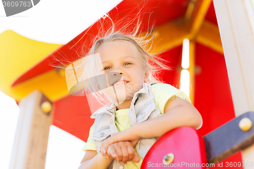 Image of happy little girl on children playground