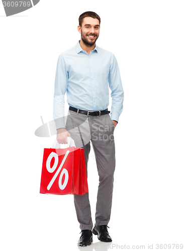 Image of smiling man with red shopping bag