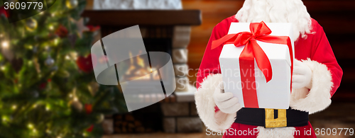 Image of man in costume of santa claus with gift box