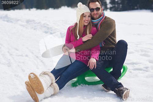 Image of happy young couple having fun on fresh show on winter vacation