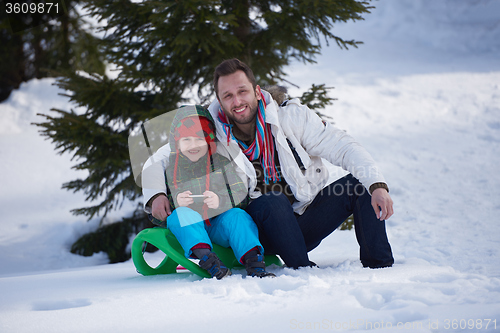 Image of portrait of father and son on snow