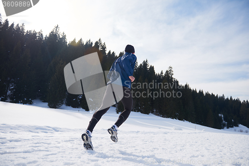 Image of jogging on snow in forest