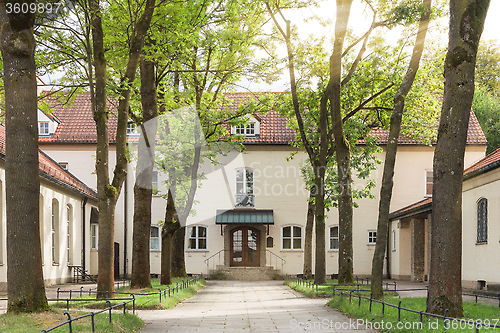 Image of Traditional pastoral Catholic church backyard in European city