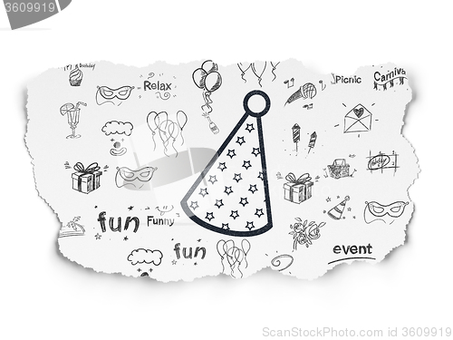 Image of Holiday concept: Party Hat on Torn Paper background