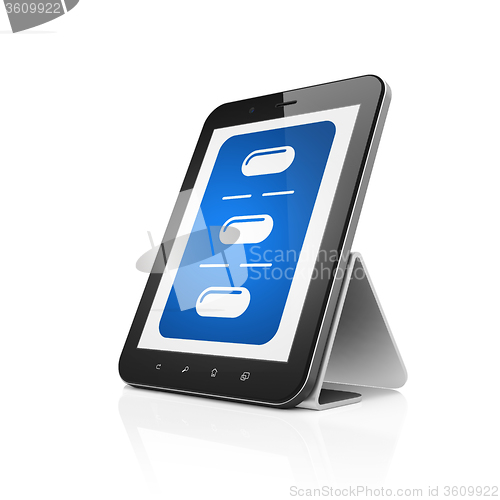 Image of Health concept: Tablet Computer with Pills Blister on display