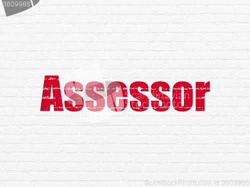 Image of Insurance concept: Assessor on wall background