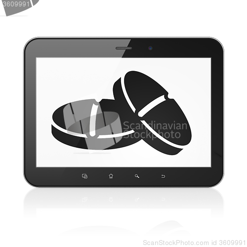 Image of Healthcare concept: Tablet Computer with Pills on display