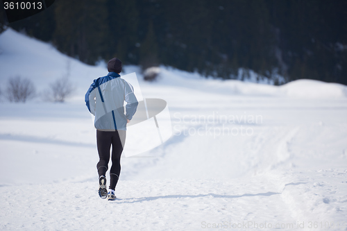 Image of jogging on snow in forest