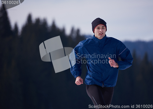 Image of couple jogging outside on snow