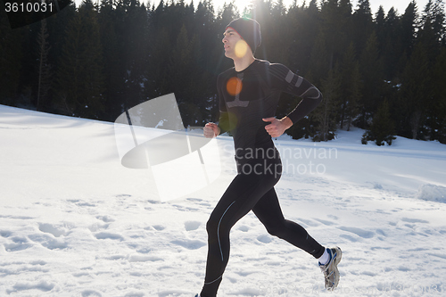 Image of jogging on snow in forest