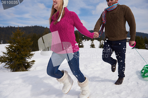 Image of happy young couple having fun on fresh show on winter vacation