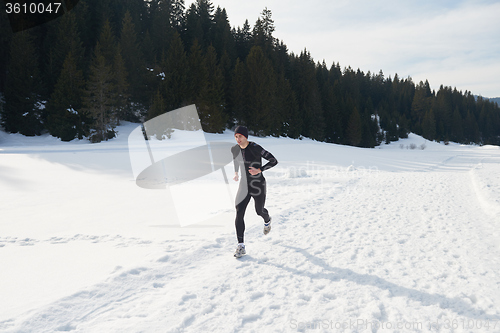 Image of jogging on snow in forest