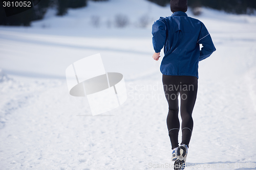 Image of jogging on snow in forest