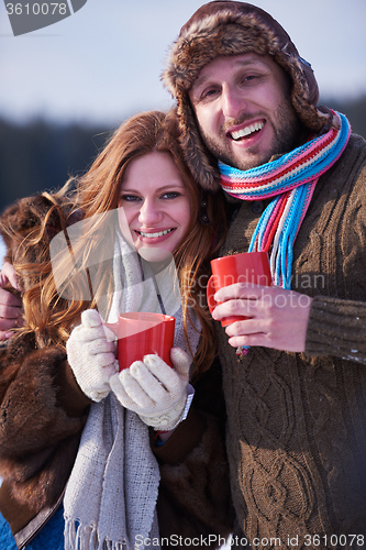 Image of couple drink warm tea at winter