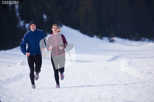 Image of couple jogging outside on snow