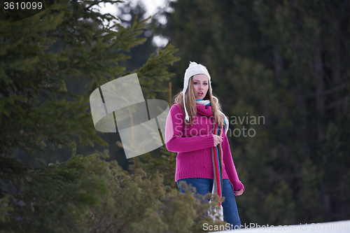 Image of portrait of beautiful young redhair woman in snow scenery