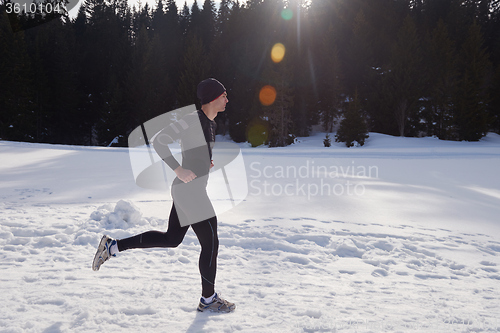 Image of jogging on snow in forest