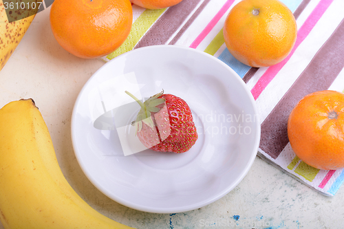 Image of Fresh organic fruits ( strawberry, banana, mandarin, orange)