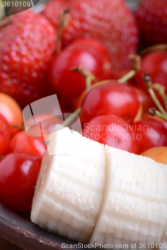 Image of Composition with fruits cherry bananas strawberry