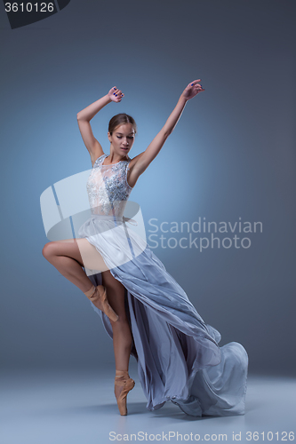 Image of The beautiful ballerina dancing in blue long dress 