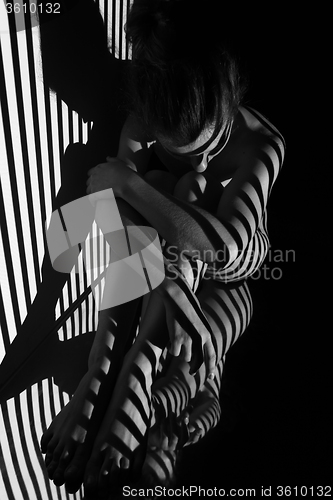 Image of The nude woman with black and white zebra stripes