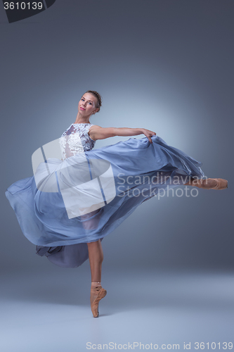 Image of The beautiful ballerina dancing in blue long dress 