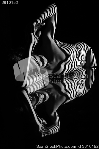 Image of The nude woman with black and white zebra stripes