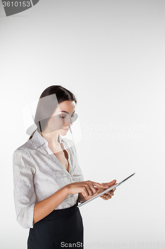 Image of Young business woman with laptop