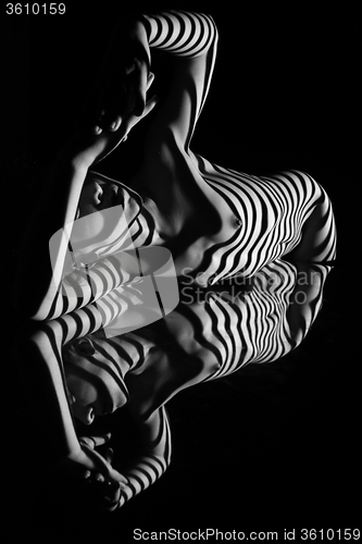 Image of The nude woman with black and white zebra stripes