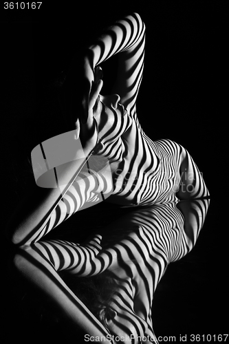 Image of The nude woman with black and white zebra stripes