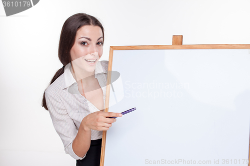 Image of young business woman showing something on the white background