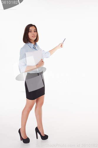 Image of young business woman showing something on the white background