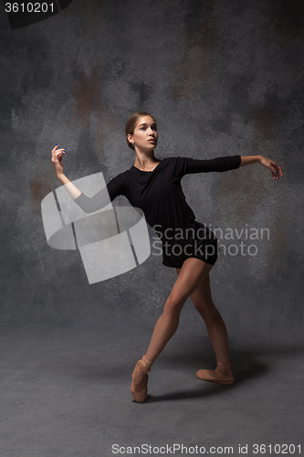 Image of Young beautiful modern style dancer posing on a studio background