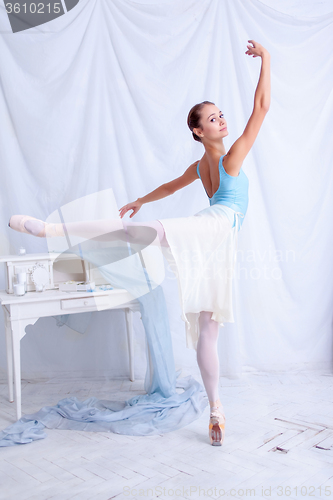 Image of Professional ballet dancer posing on white