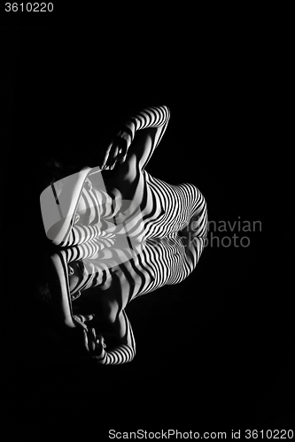 Image of The nude woman with black and white zebra stripes