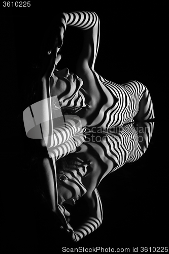 Image of The nude woman with black and white zebra stripes