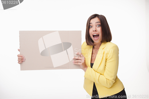 Image of Businesswoman showing board or banner with copy space on white background 
