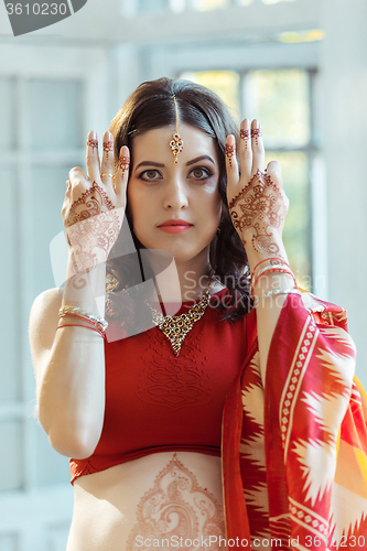 Image of Indian picture on woman hands, mehendi tradition decoration