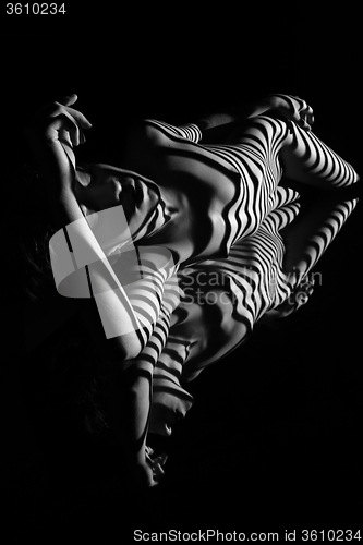 Image of The nude woman with black and white zebra stripes