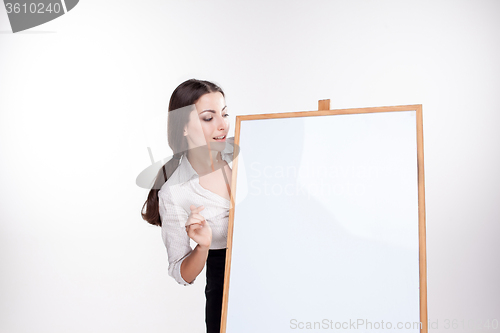 Image of young business woman showing blank signboard on white background