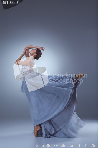 Image of The beautiful ballerina dancing in blue long dress 