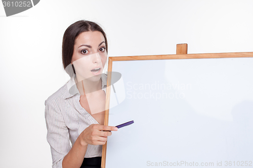 Image of young business woman showing something on the white background