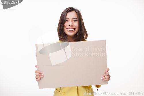 Image of Businesswoman showing board or banner with copy space on white background 