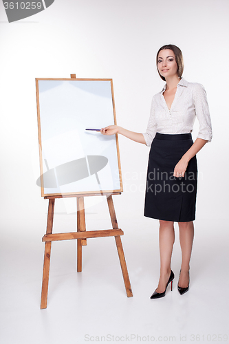 Image of young business woman showing something on the white background